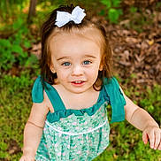 Lilly joined the competition — help win amazing prizes! toddler, child, girl, outdoor, grass, greenery, forest, romper, bow, smile, face, blue_eyes, hair_accessory, summer, nature, portrait, cute, happy, playful, person