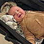 baby, baby_accessory, baby_item, blanket, child, clothing, comfort, cute, face, happy, hoodie, indoor, infant, pacifier, person, relaxed, smiling, soft, stroller, toy