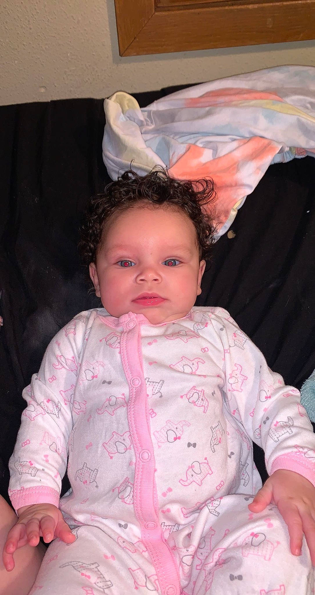 Taelynn is registered to the contest to win money with this photo: baby, baby_products, baby_toddler_clothing, chair, cheek, child, chin, comfort, event, eye, eyebrow, eyelash, fun, happy, iris, person, pink, sitting, skin, sleeve