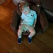 Spencer joined the competition — help win amazing prizes! toddler, child, sleeping, chair, bear_chair, mickey_mouse, tshirt, shorts, sneakers, wooden_floor, indoor, footwear, person, cozy, home, furniture, relaxing, cute, small_child, casual_clothing
