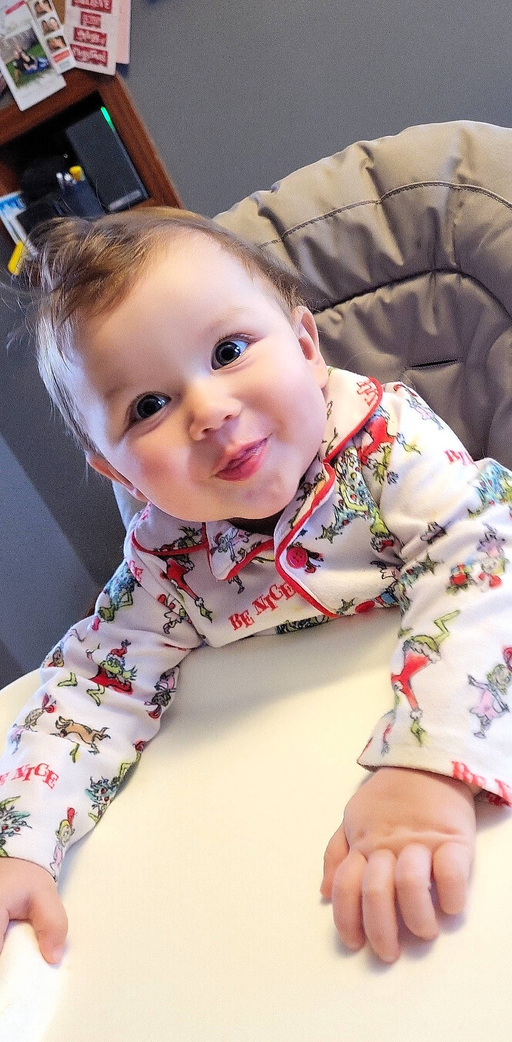 Austyn is registered to the contest to win money with this photo: baby_toddler_clothing, cheek, child, collar, comfort, dress_shirt, facial_expression, flooring, happy, head, outerwear, person, product, shirt, sitting, skin, sleeve, smile, t_shirt, textile