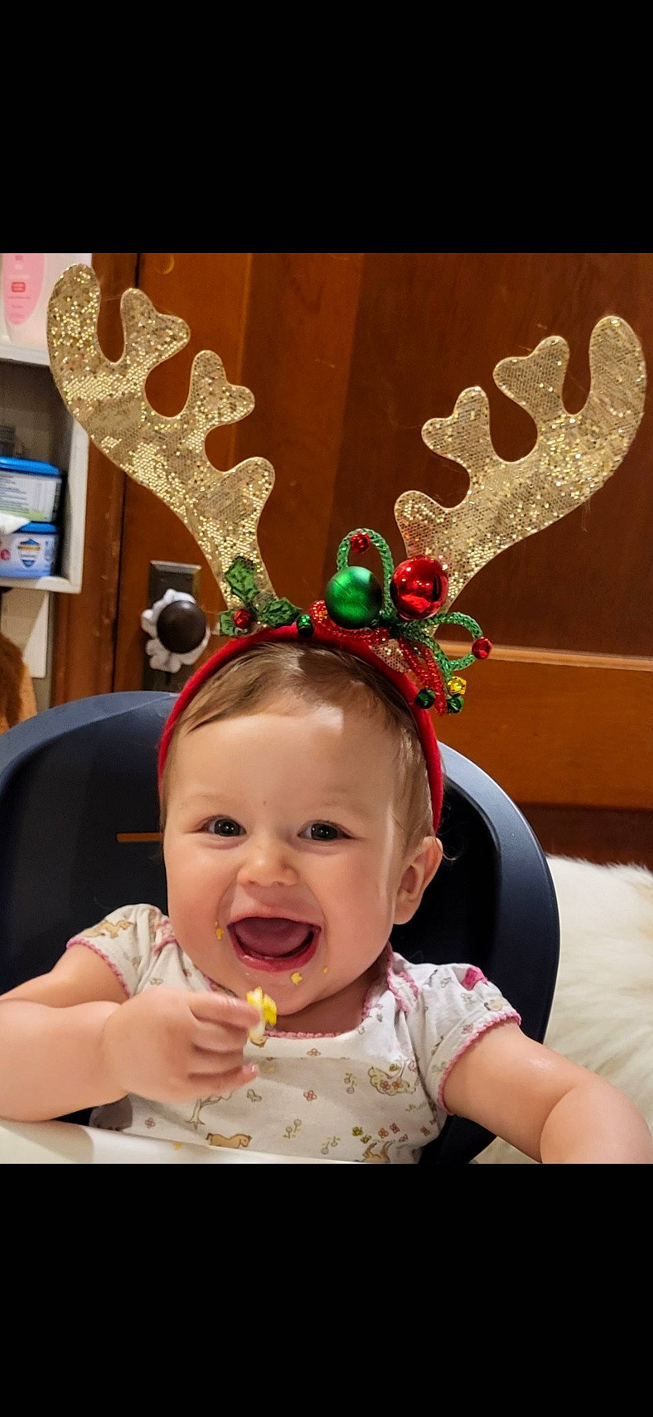 Austyn is registered to the contest to win money with this photo: baby, baby_toddler_clothing, child, christmas, costume_hat, event, fashion_accessory, fawn, fun, happy, headpiece, holiday, holiday_ornament, natural_material, person, photograph, pink, reindeer, snapshot, toddler