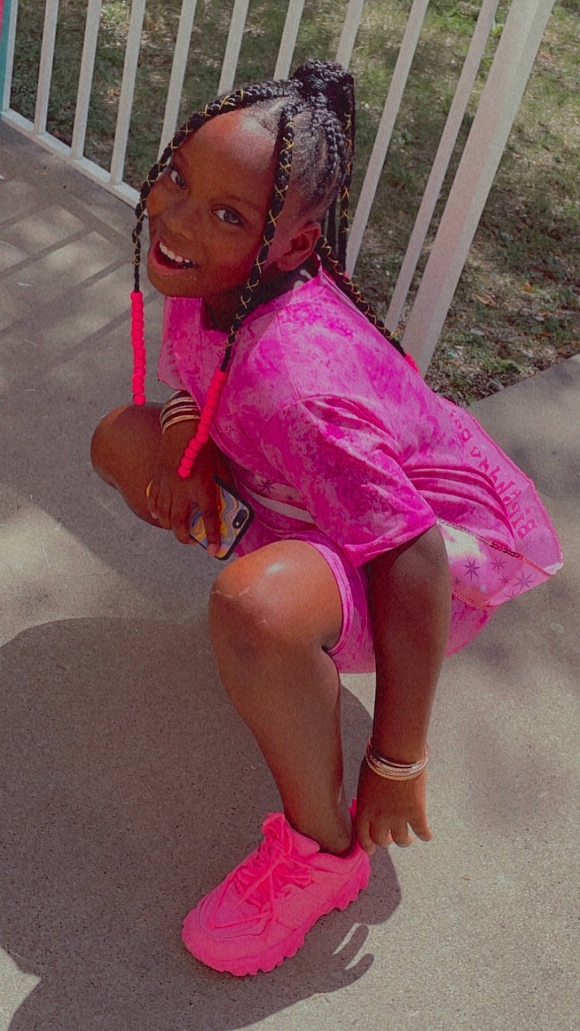 Desire White joined the competition — help win amazing prizes! barefoot, calf, child, fashion_accessory, foot, fun, grass, happy, human_leg, jewellery, joy, knee, leisure, magenta, person, pink, recreation, sandal, sitting, smile