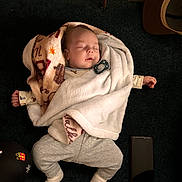 Beau joined the competition — help win amazing prizes! baby, blanket, carpet, child, clothing, cozy, cute, feet, hands, indoor, infant, pacifier, peaceful, person, relaxed, resting, sleeping, smartphone, soft, wearing