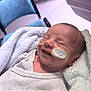 Mahë participe au concours pour gagner de l'argent avec cette photo : baby, blanket, blue_chair, clothing, comfort, cozy, cute, face, feeding_tube, head, healthcare, hospital, indoors, infant, medical_tape, newborn, person, resting, smile, soft_lighting