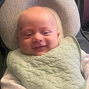 Riley-Jay is registered to the contest to win money with this photo: baby, baby_bib, baby_seat, bib, child, clothing, comfort, cushion, cute, face, happy, head, indoors, infant, newborn, portrait, seat, smile, soft_light, young