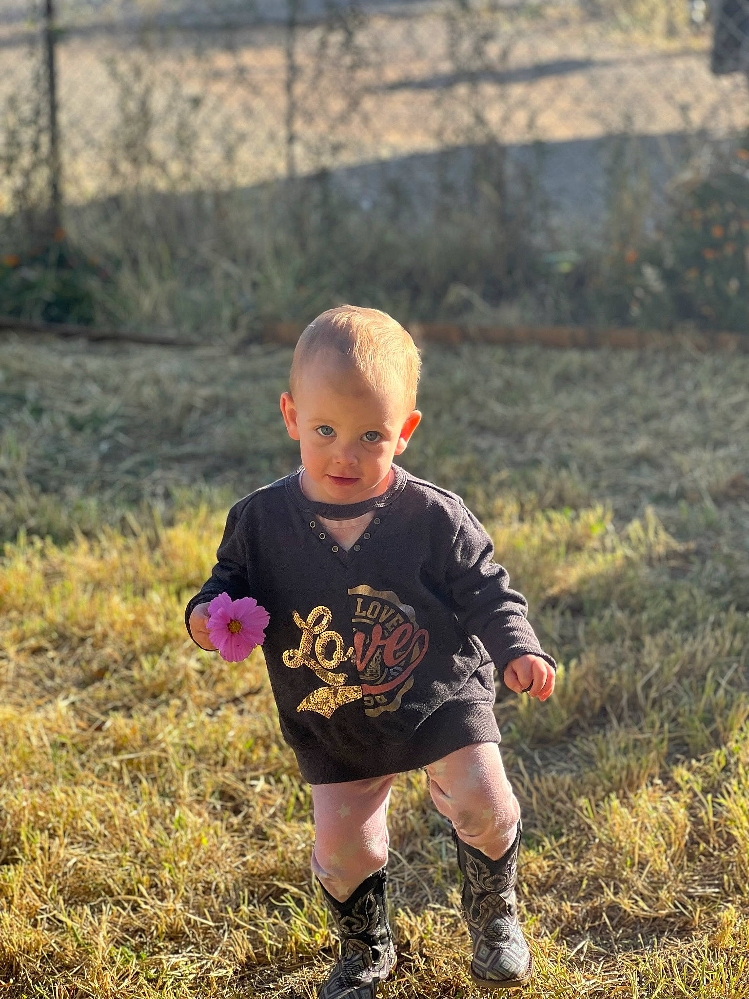 Oaklee joined the competition — help win amazing prizes! baby, baby_toddler_clothing, child, fence, flash_photography, fun, grass, grassland, happy, landscape, meadow, people_in_nature, person, portrait_photography, prairie, recreation, sitting, sleeve, soil, t_shirt