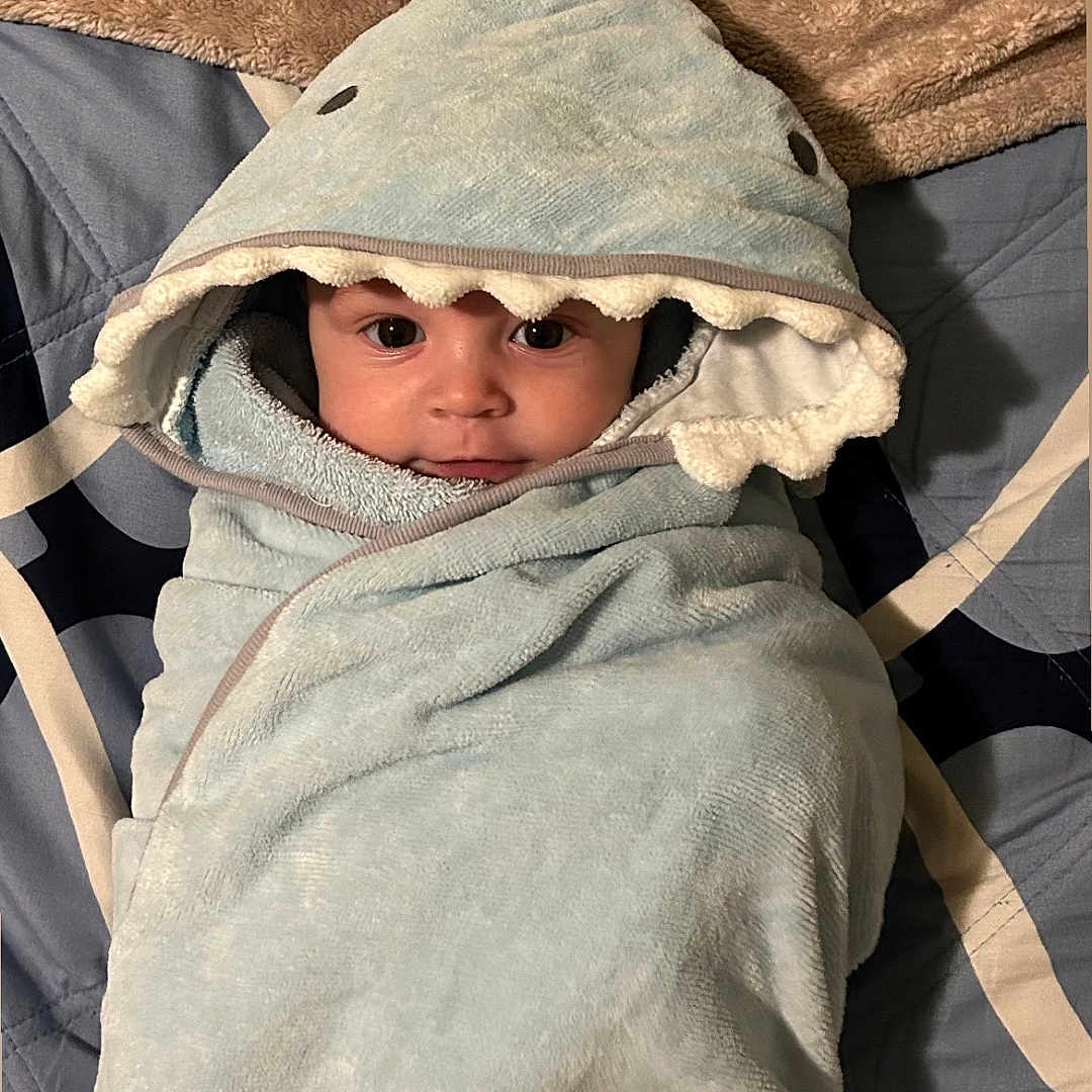 Jasper joined the competition — help win amazing prizes! baby, blanket, clothing, face, happy, head, hood, person, photography, portrait, smile