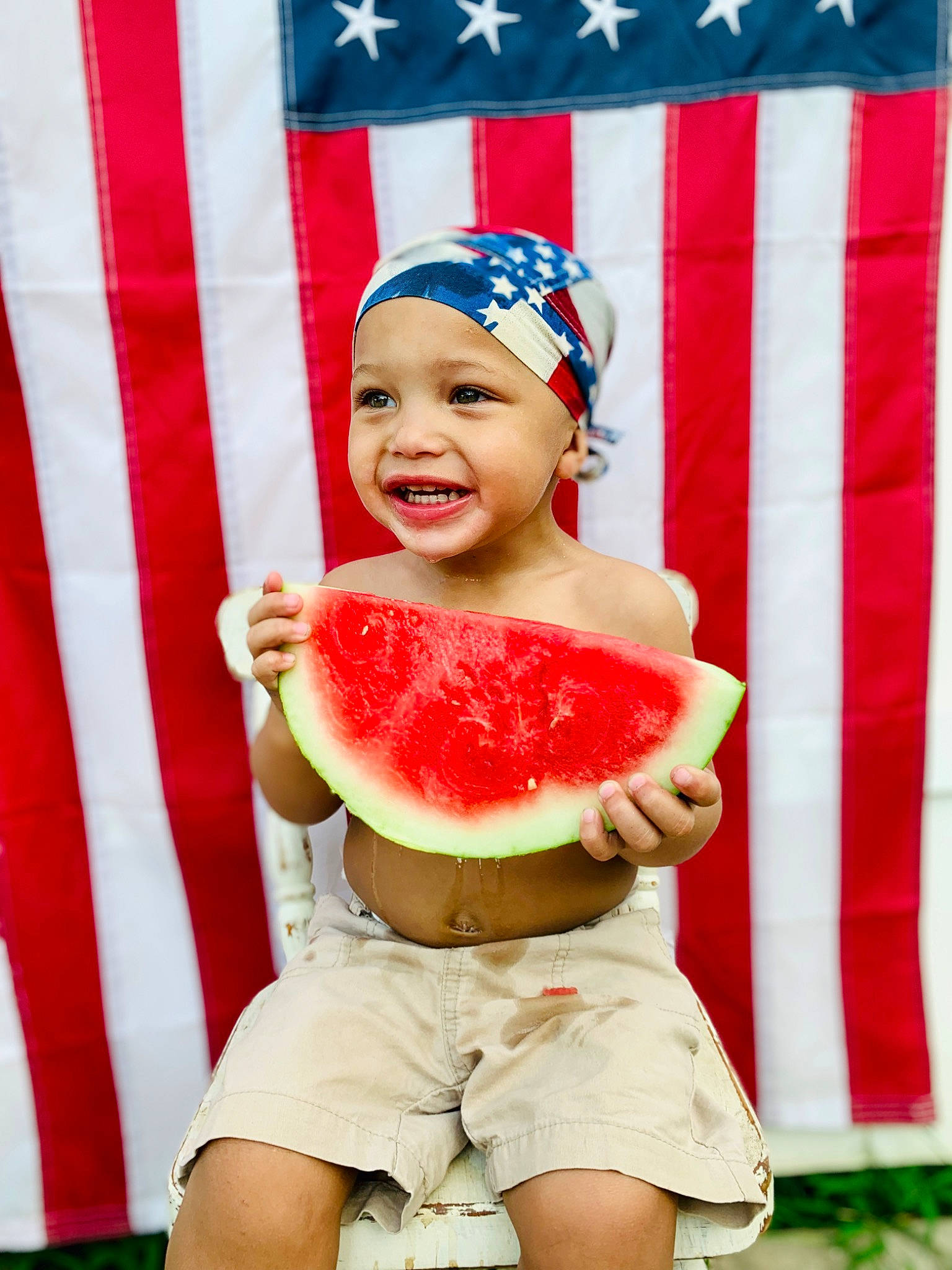 Maverick joined the competition — help win amazing prizes! abdomen, child, costume, curtain, entertainment, event, eye, flag_of_the_united_states, fruit, fun, happy, headwear, human_leg, joy, melon, peach, performing_arts, person, shorts, smile