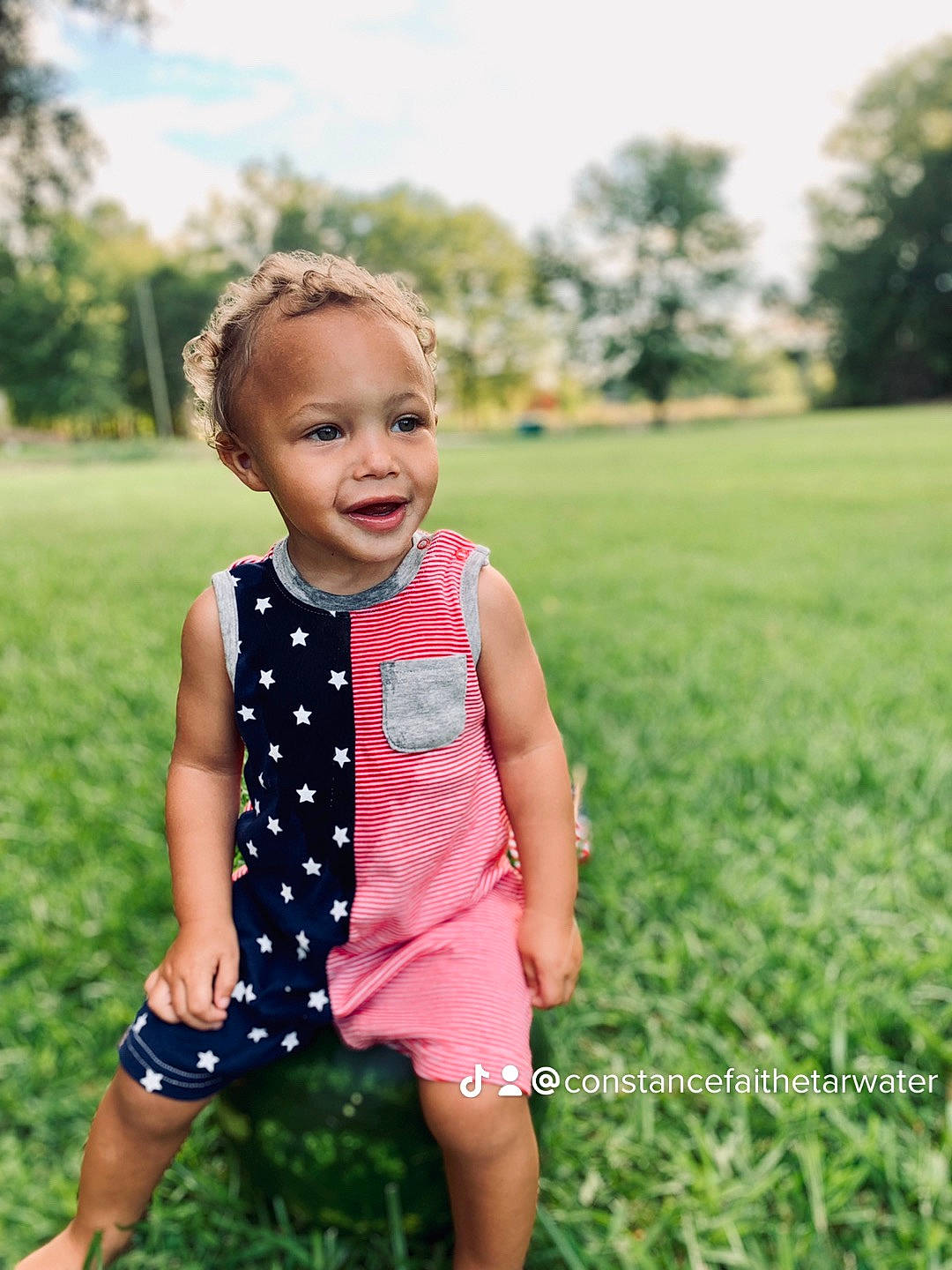 Maverick joined the competition — help win amazing prizes! baby, baby_toddler_clothing, dress, face, flash_photography, grass, grass_family, grassland, green, happy, leaf, meadow, people_in_nature, person, plant, sky, sleeve, summer, sunlight, toddler