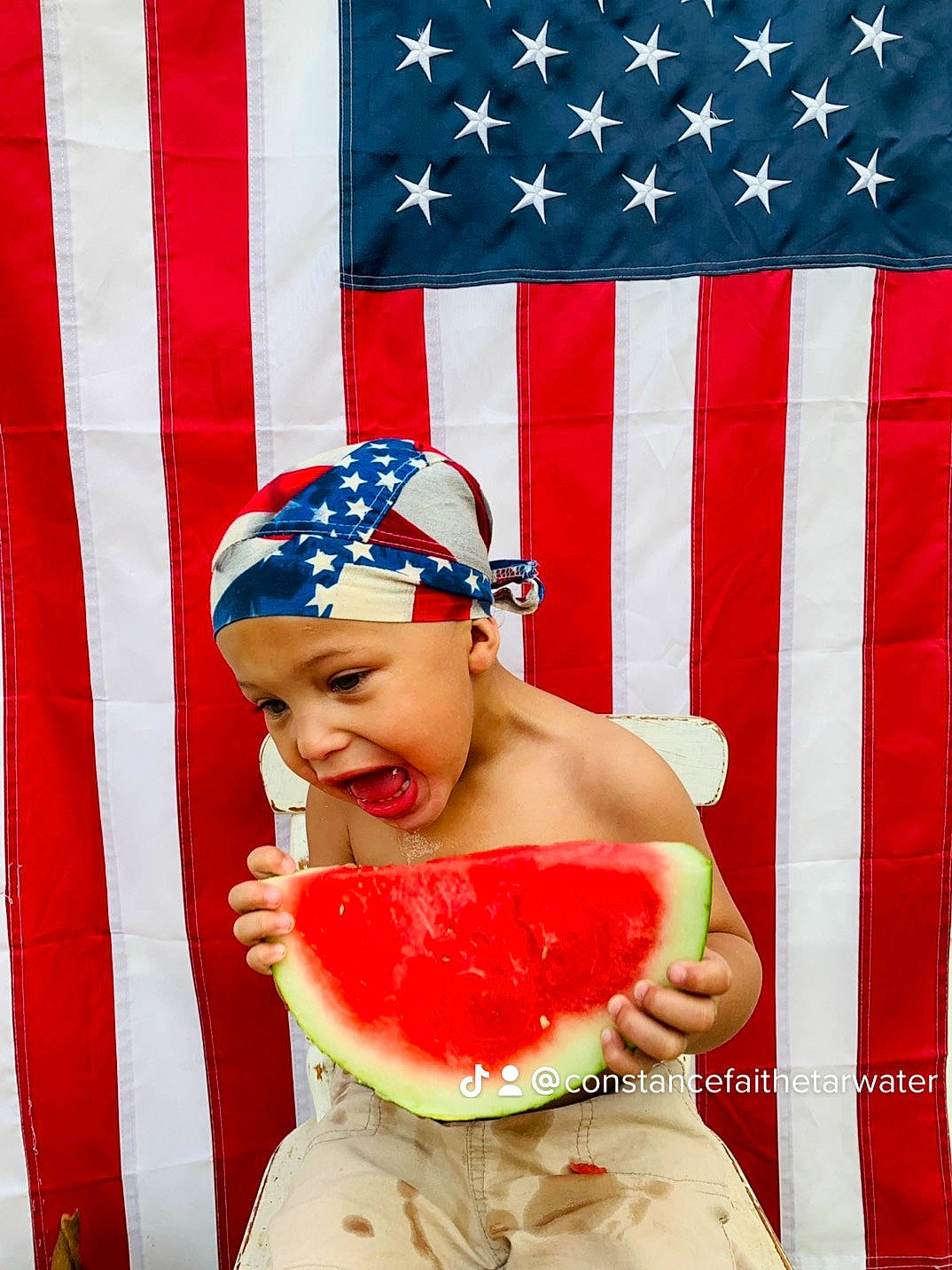 Maverick joined the competition — help win amazing prizes! blue, cap, child, citrullus, event, flag, flag_day_usa, flag_of_the_united_states, food, fruit, fun, happy, headwear, ingredient, melon, person, red, smile, sweetness, textile