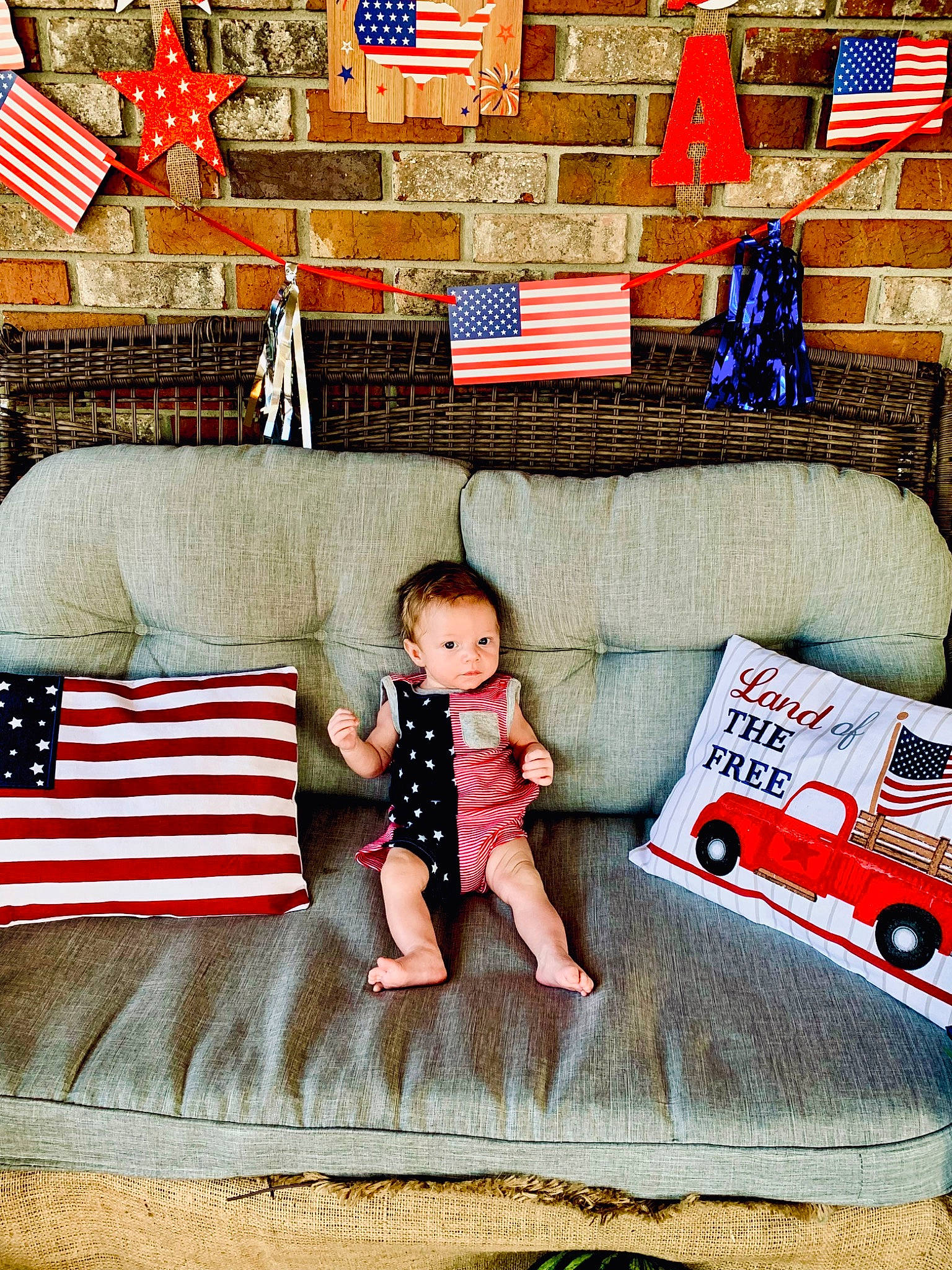 Justice joined the competition — help win amazing prizes! baby_toddler_clothing, child, comfort, couch, flooring, happy, line, linens, living_room, mammal, people, person, pillow, product, rectangle, red, room, t_shirt, textile, toddler
