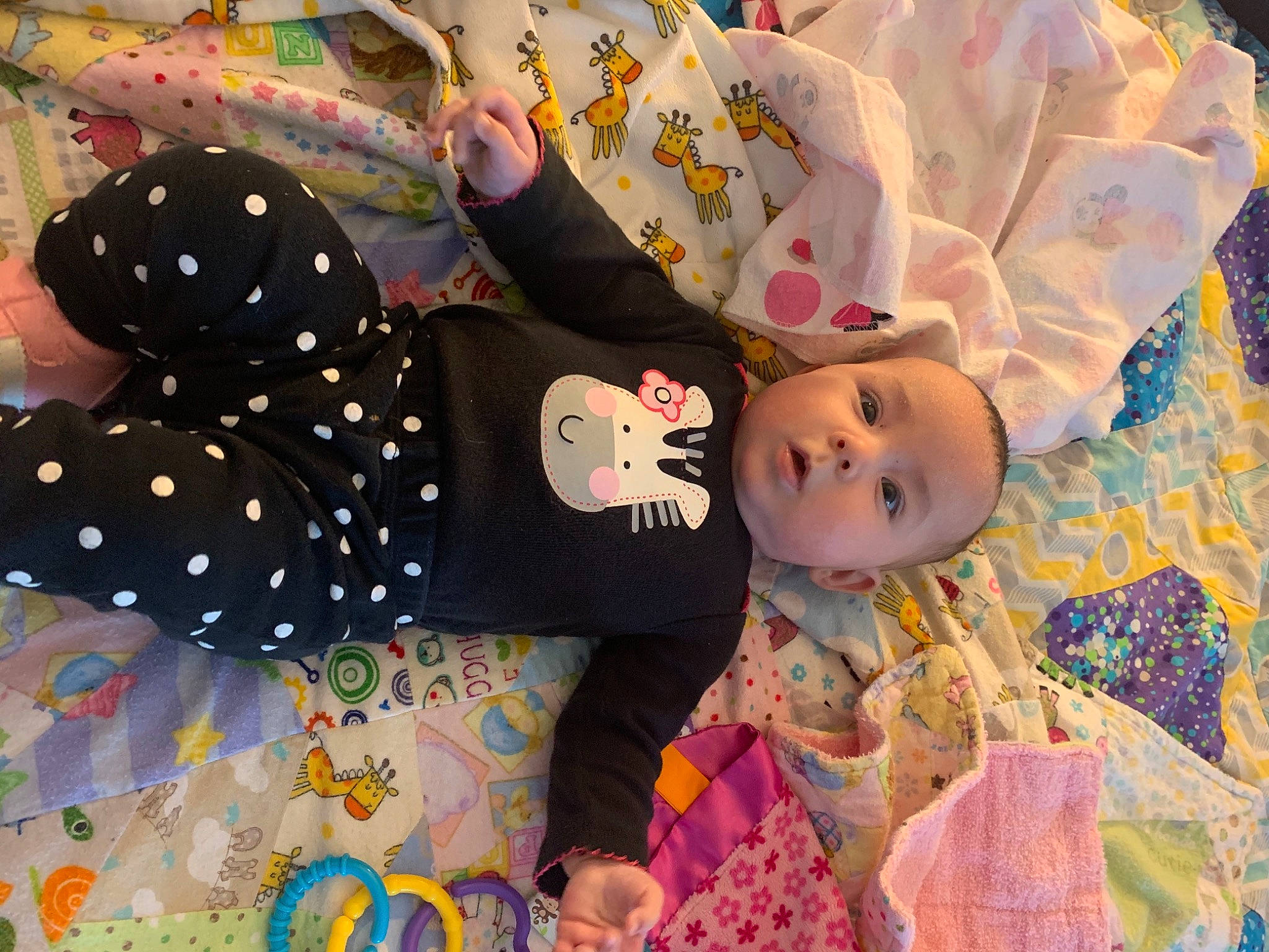 Mercedes is registered to the contest to win money with this photo: baby, baby_products, baby_toddler_clothing, linens, pattern, person, polka_dot, textile