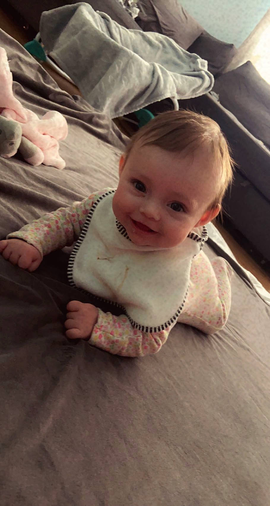 Lyra is registered to the contest to win money with this photo: baby, baby_toddler_clothing, cheek, chin, comfort, eye, facial_expression, finger, floor, hand, happy, human_body, joint, joy, leg, mouth, nose, person, skin, sleeve