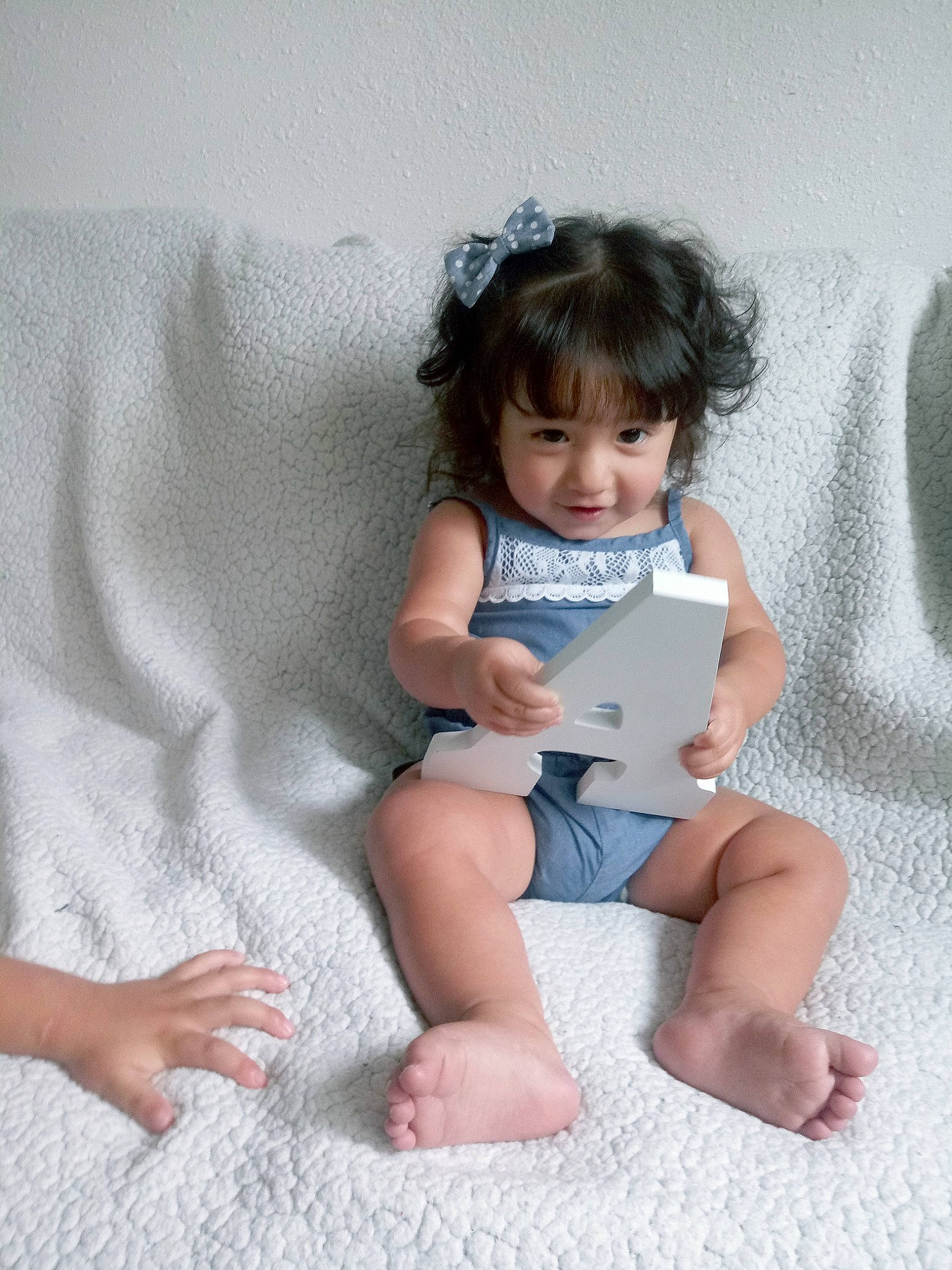 Abella joined the competition — help win amazing prizes! baby, baby_toddler_clothing, barefoot, child, electronic_device, hand, leg, person, play, sitting, skin, smile, toddler