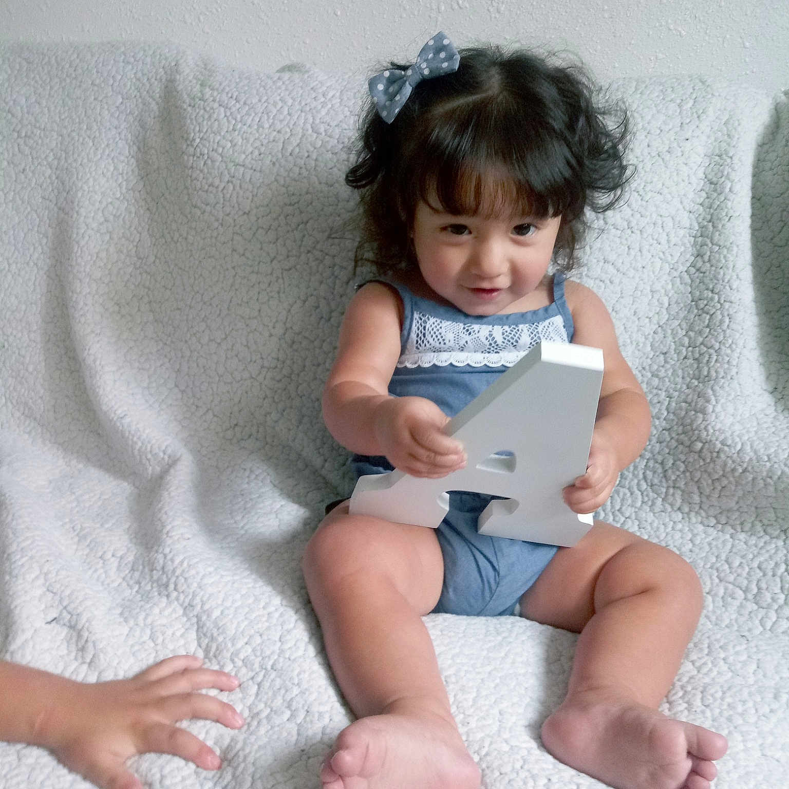 Abella joined the competition — help win amazing prizes! baby, baby_toddler_clothing, barefoot, child, electronic_device, hand, leg, person, play, sitting, skin, smile, toddler