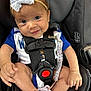 Londyn Serena joined the competition — help win amazing prizes! baby, child, car_seat, harness, pacifier, smile, face, blue_eyes, white_bow, headband, clothing, sitting, infant, cute, safety, seat_belt, person, indoors, closeup, happy