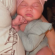 Londyn Serena is registered to the contest to win money with this photo: baby, sleeping, headband, pink_bow, infant, child, person, arm, clothing, soft_fabric, closeup, cute, peaceful, resting, portrait, indoors, skin, hand, newborn, toddler