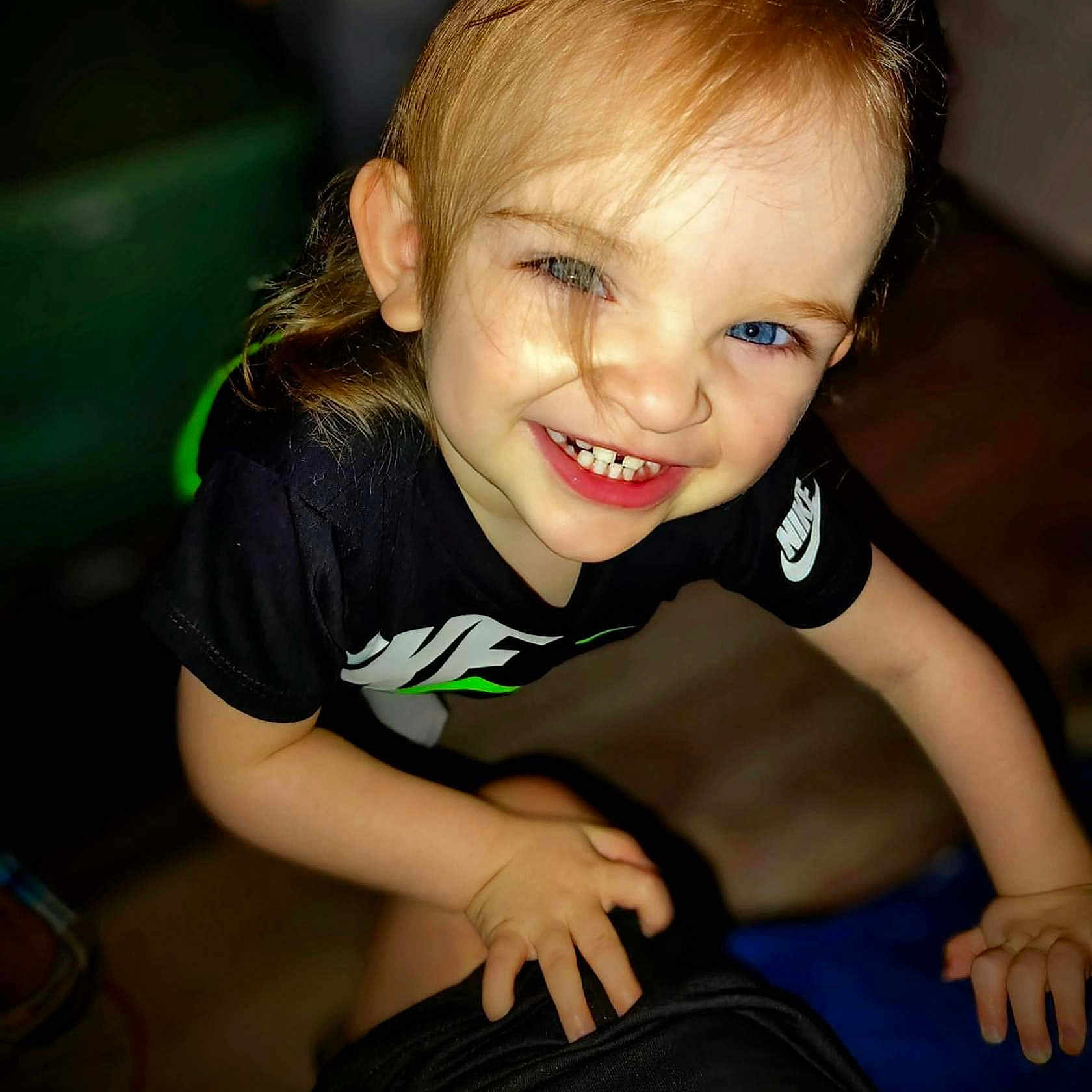 Gracie joined the competition — help win amazing prizes! blond_hair, blue_eyes, casual, child, closeup, clothing, cute, expression, face, hand, happy, indoor, joyful, nike_shirt, person, playful, portrait, smiling, toddler, young_child