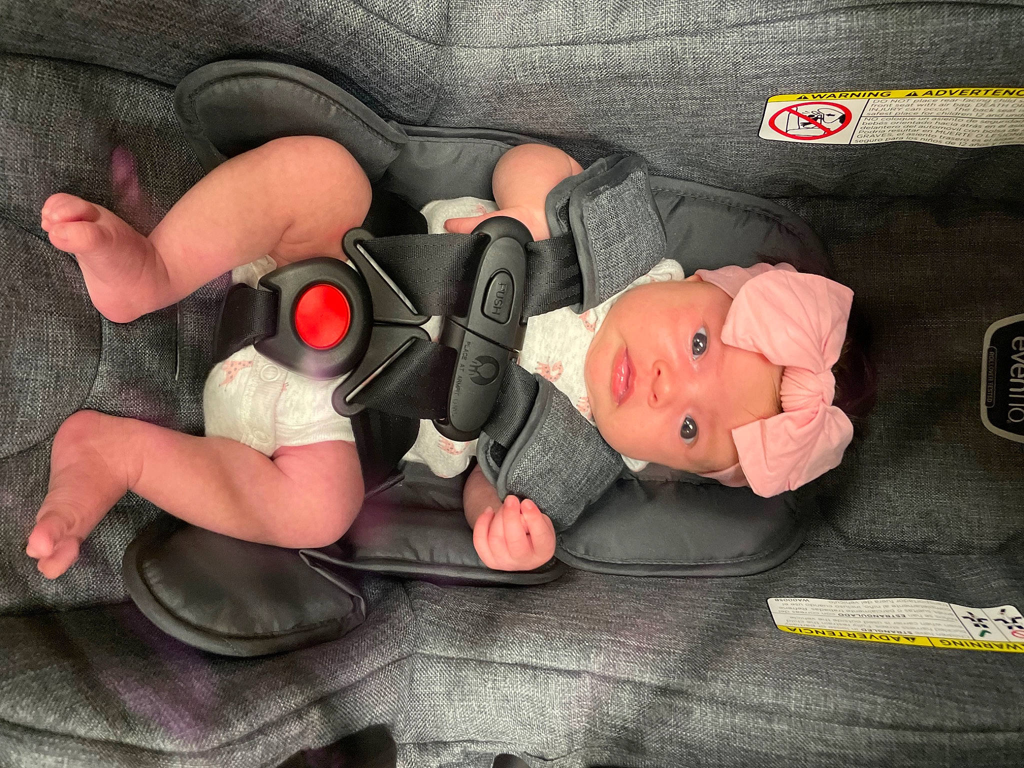 Lakelyn is registered to the contest to win money with this photo: audio_equipment, auto_part, automotive_design, baby_products, bag, car_seat, carmine, comfort, doll, headwear, human_body, human_leg, knee, lap, linens, motor_vehicle, nail, person, textile, thigh