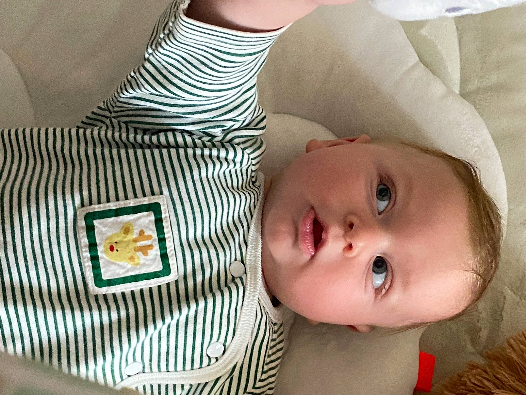 Aren is registered to the contest to win money with this photo: baby, baby_toddler_clothing, child, comfort, couch, eyelash, fashion_accessory, happy, hat, linens, lip, neck, nose, pattern, person, room, skin, sleeve, sunglasses, textile