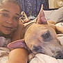 Coco Channel is registered to the contest to win money with this photo: person, dog, bed, indoor, relaxed, selfie, ear, fur, blanket, comfort, resting, face, expression, animal, pet, home, furniture, curtain, skin, portrait