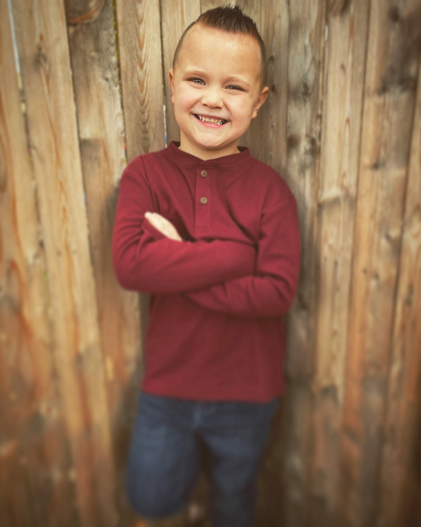 Bentley joined the competition — help win amazing prizes! child, chin, clothing, eye, face, flash_photography, gesture, grass, happy, hardwood, jeans, joy, organ, people_in_nature, person, sitting, sleeve, smile, t_shirt, tree