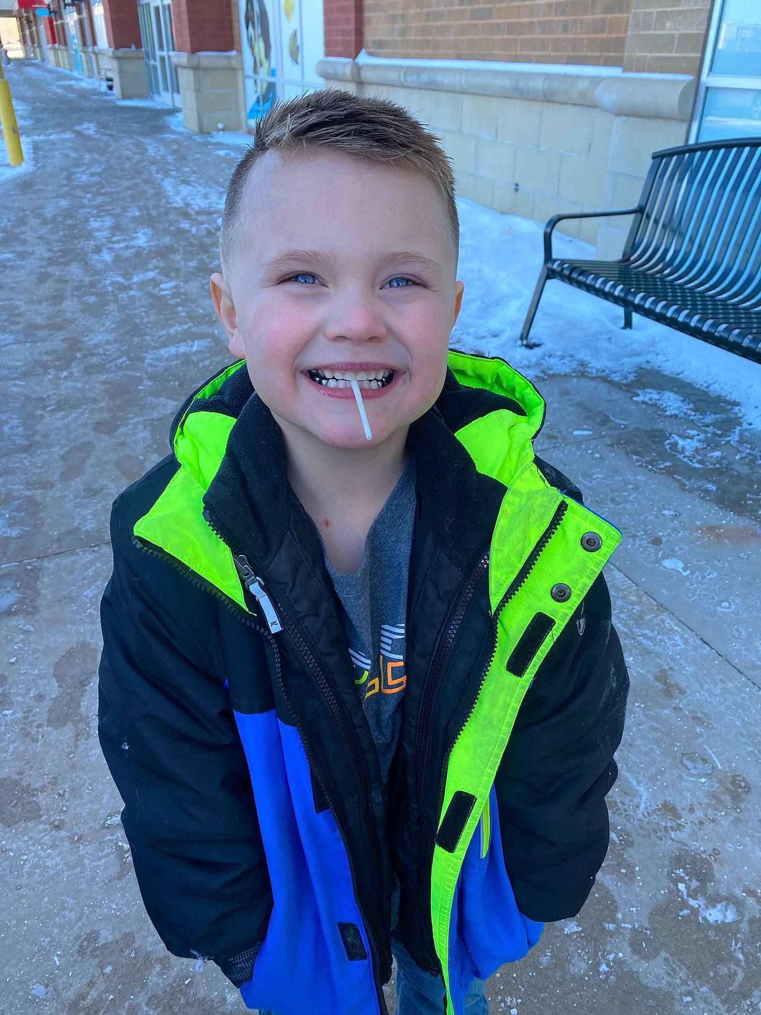 Bentley joined the competition — help win amazing prizes! bench, blue, child, electric_blue, fashion_accessory, freezing, fun, grass, happy, high_visibility_clothing, joy, leisure, outdoor_furniture, person, personal_protective_equipment, recreation, sleeve, smile, snow, windbreaker