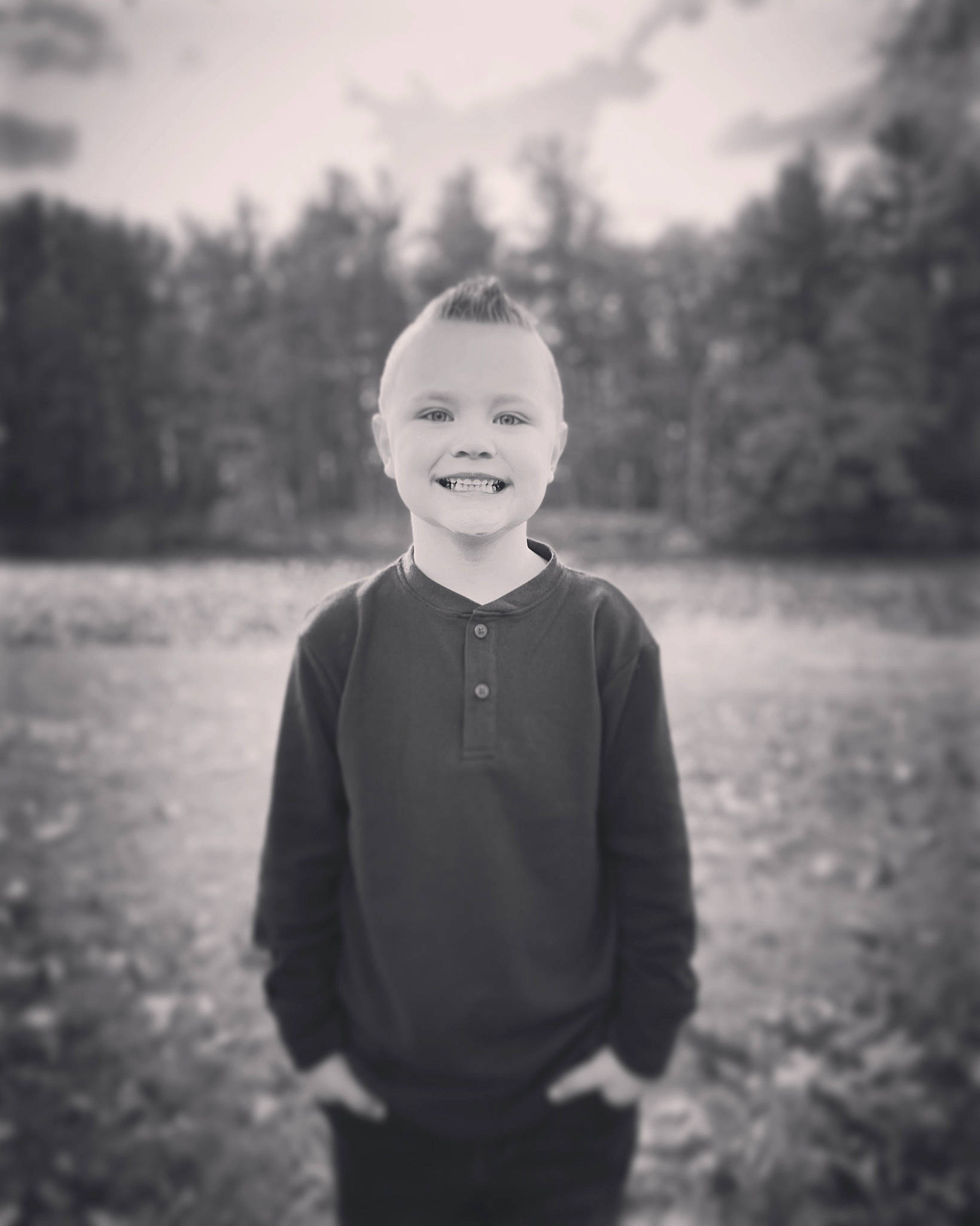 Bentley joined the competition — help win amazing prizes! atmospheric_phenomenon, black_and_white, cloud, face, flash_photography, fun, grass, happy, horizon, joy, landscape, monochrome, monochrome_photography, person, sky, smile, standing, style, t_shirt, tints_and_shades