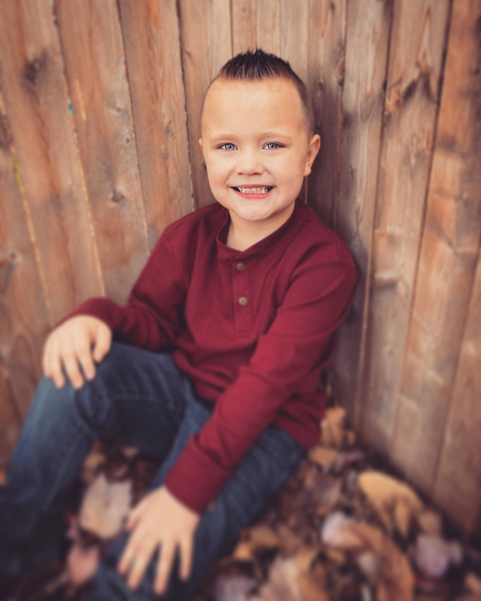 Bentley is registered to the contest to win money with this photo: autumn, child, facial_expression, flash_photography, fun, fur, grass, happy, joy, laugh, leg, people_in_nature, person, portrait, portrait_photography, sitting, smile, standing, t_shirt, toddler