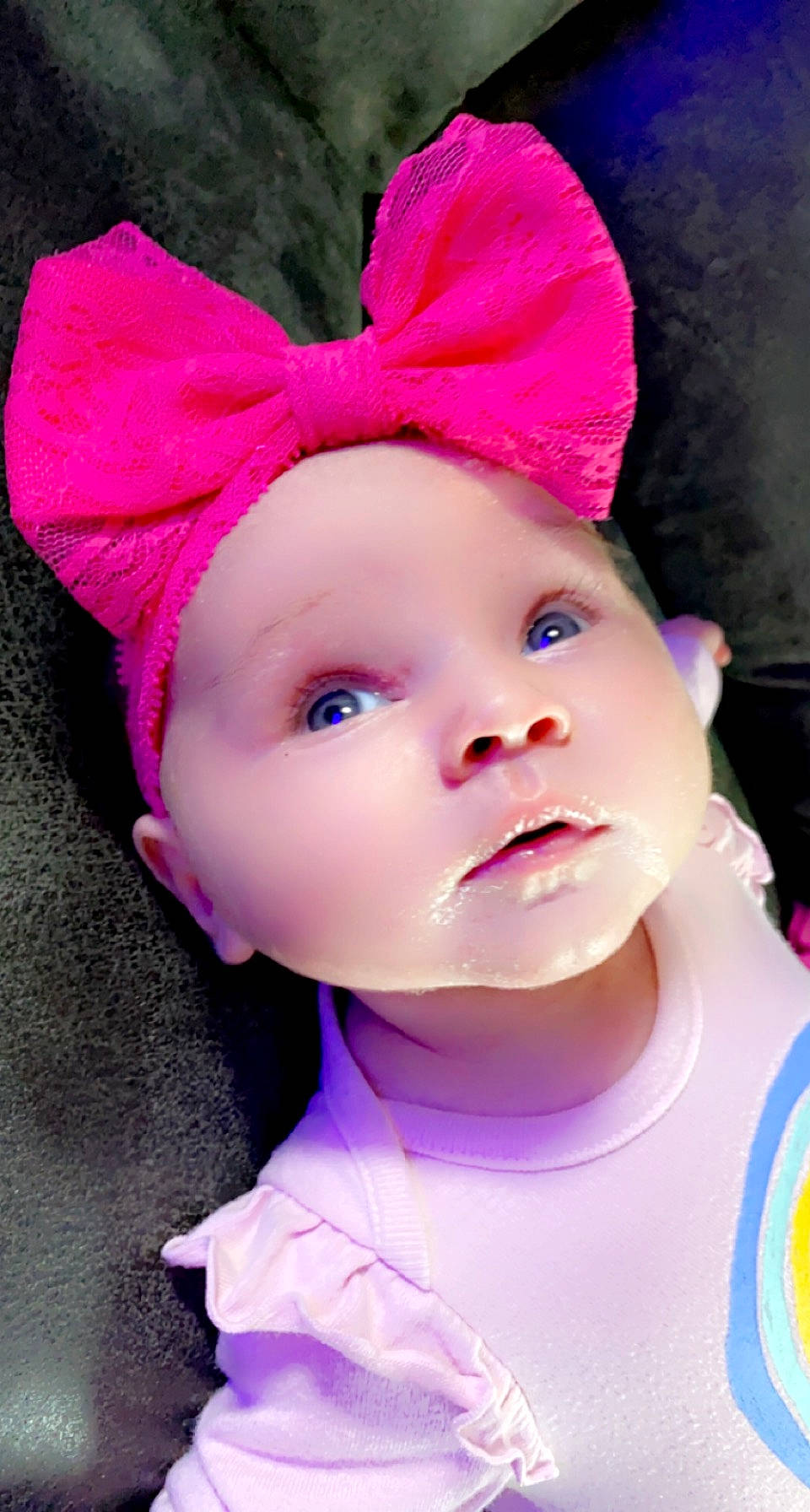 Alaina is registered to the contest to win money with this photo: baby, baby_toddler_clothing, cap, cheek, child, costume_hat, eyelash, face, happy, hat, headband, headgear, headpiece, headwear, lip, magenta, person, pink, purple, skin