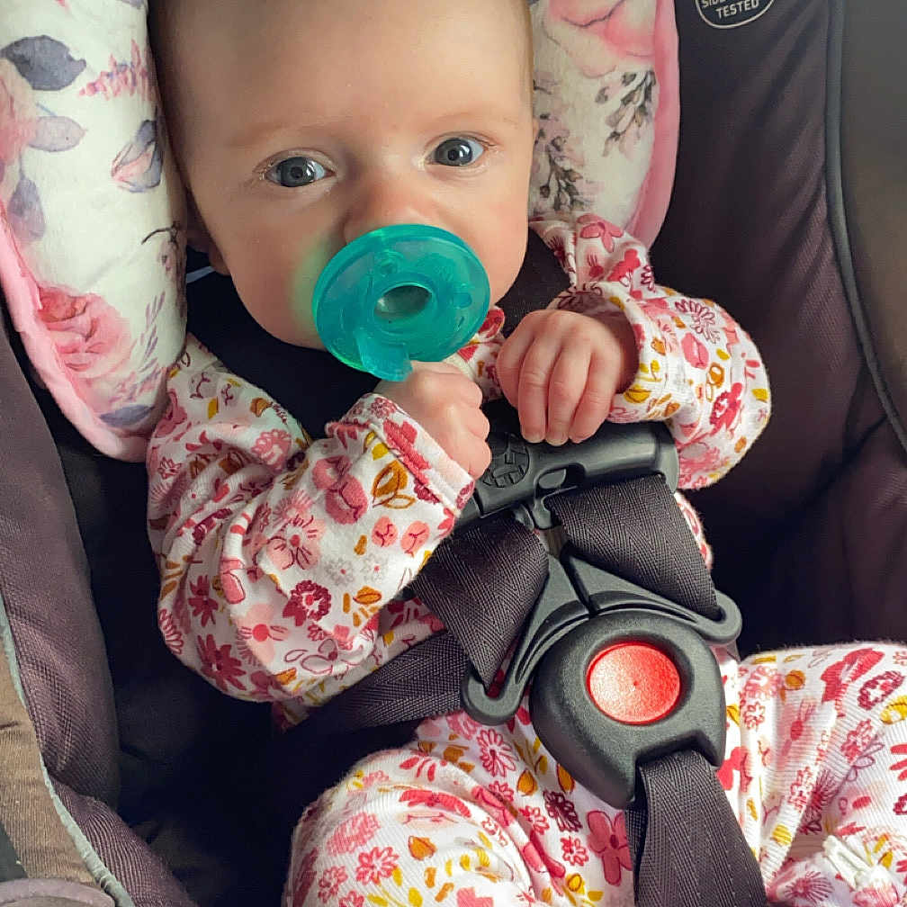 Raelynn is registered to the contest to win money with this photo: baby, bodypart, car, car_interior, carseat, clothing, coat, cushion, face, finger, gun, hand, head, homedecor, jacket, person, photography, portrait, transportation, vehicle