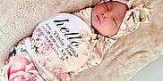 Veniza Snow is registered to the contest to win money with this photo: newborn, baby, sleeping, blanket, headband, floral_pattern, infant, soft_texture, birth_announcement, card, peaceful, swaddled, cute, portrait, indoors, closeup, skin, face, resting, cozy