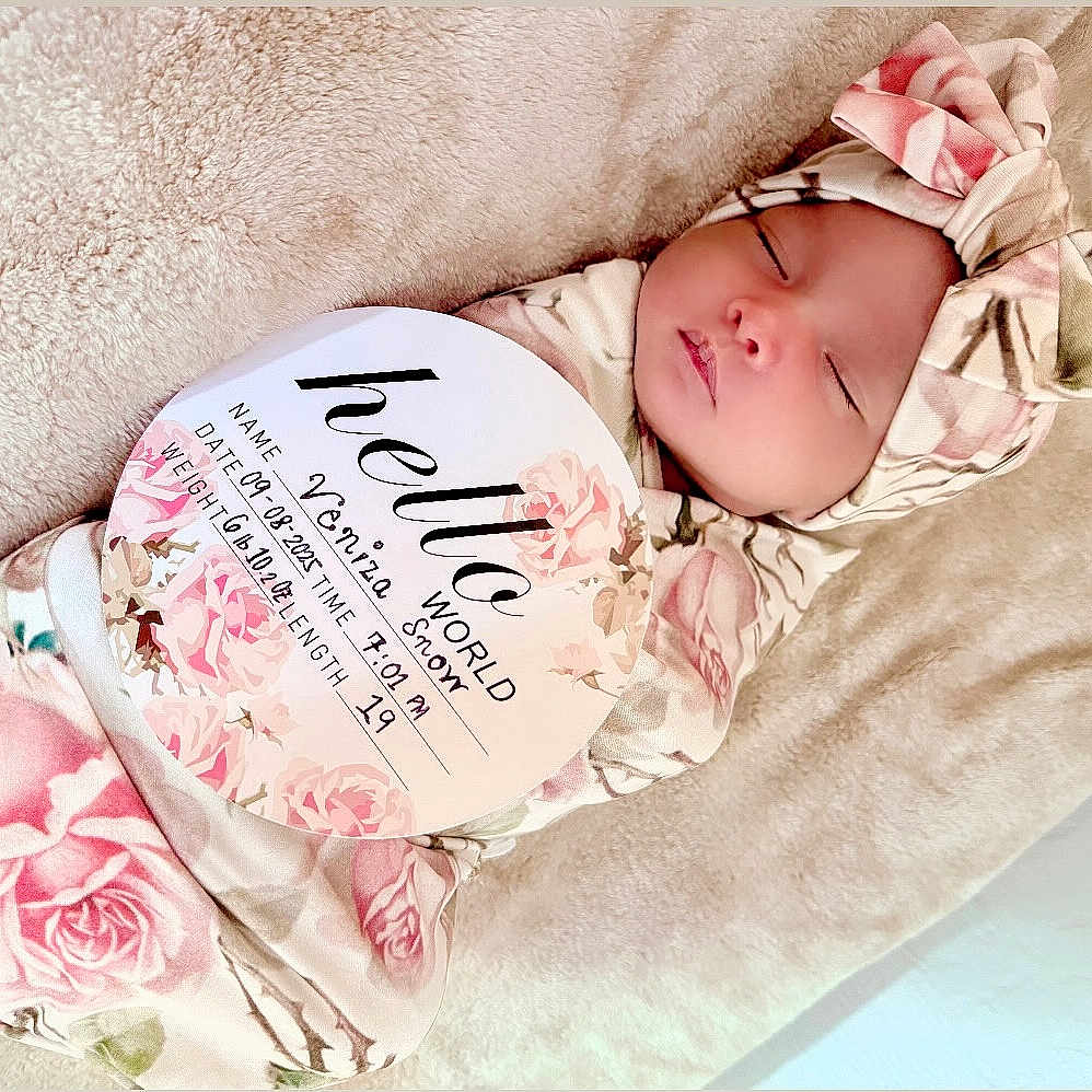 Veniza Snow is registered to the contest to win money with this photo: baby, birth_announcement, blanket, card, closeup, cozy, cute, face, floral_pattern, headband, indoors, infant, newborn, peaceful, portrait, resting, skin, sleeping, soft_texture, swaddled