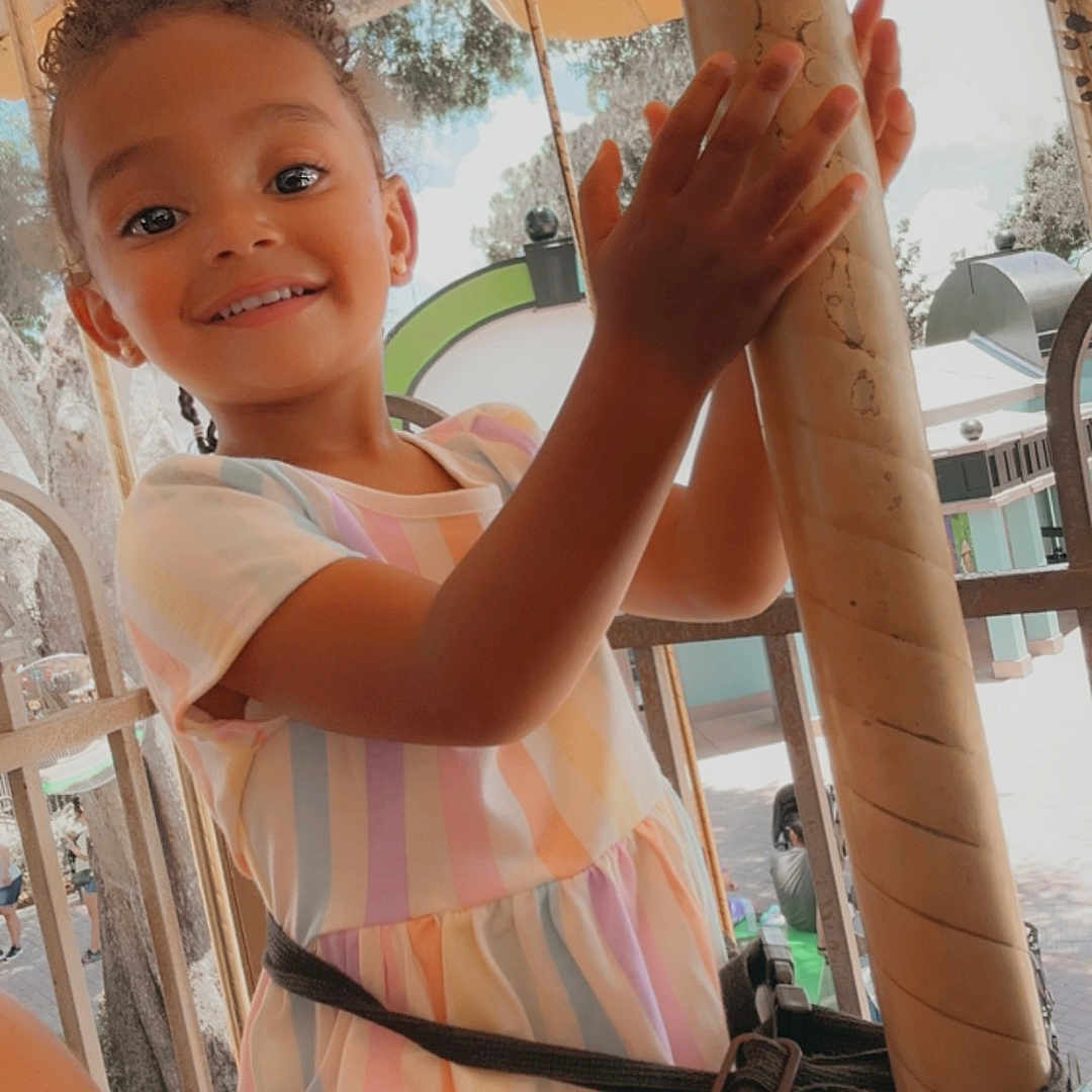 Mia is registered to the contest to win money with this photo: amusementpark, bodypart, boy, child, clothing, dress, face, finger, hand, happy, head, male, outdoorplayarea, outdoors, person, photography, playarea, portrait, smile, t_shirt