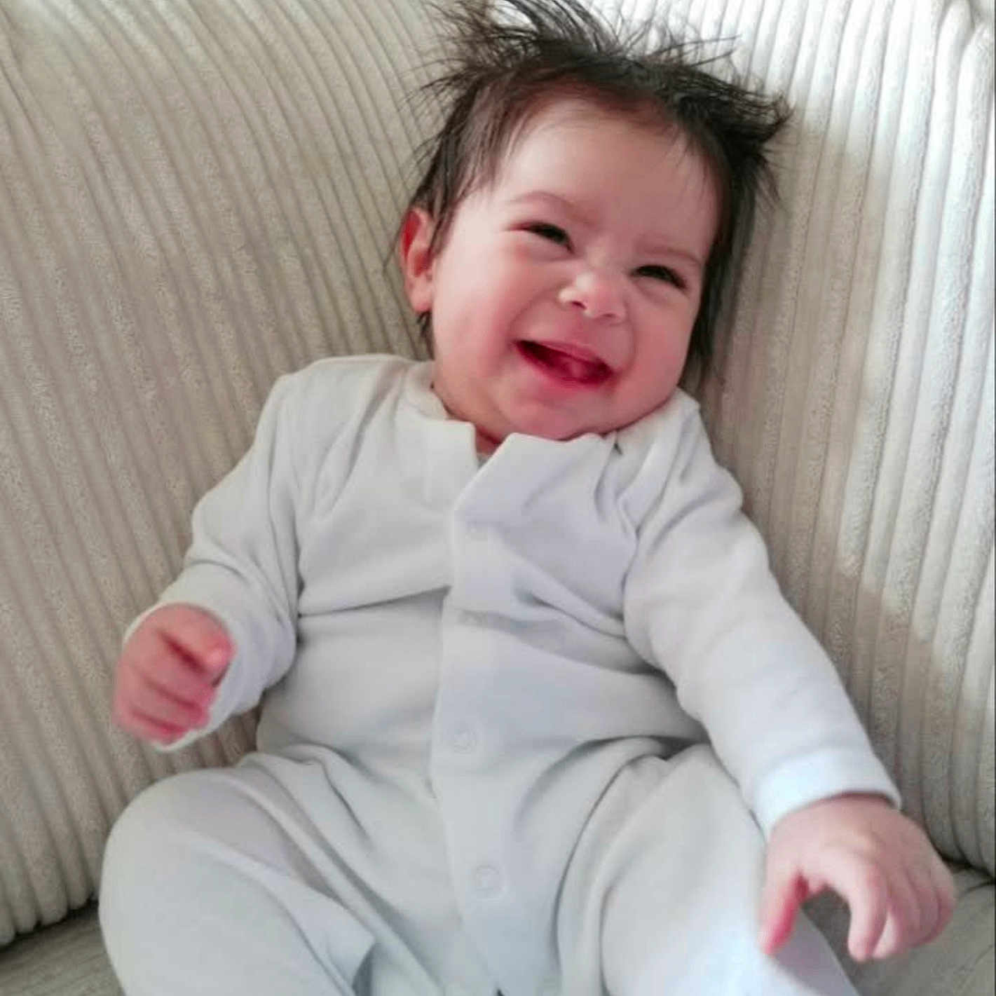 Clark is registered to the contest to win money with this photo: baby, babylaughing, cushion, face, happy, head, homedecor, laughing, person, photography, portrait, smile