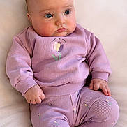 Elara-Alma joined the competition — help win amazing prizes! baby, infant, child, purple_clothing, sitting, cute, soft_texture, long_sleeves, pants, small_hands, blue_eyes, casual_wear, indoors, portrait, young_child, plush, comfort, human, face, expression