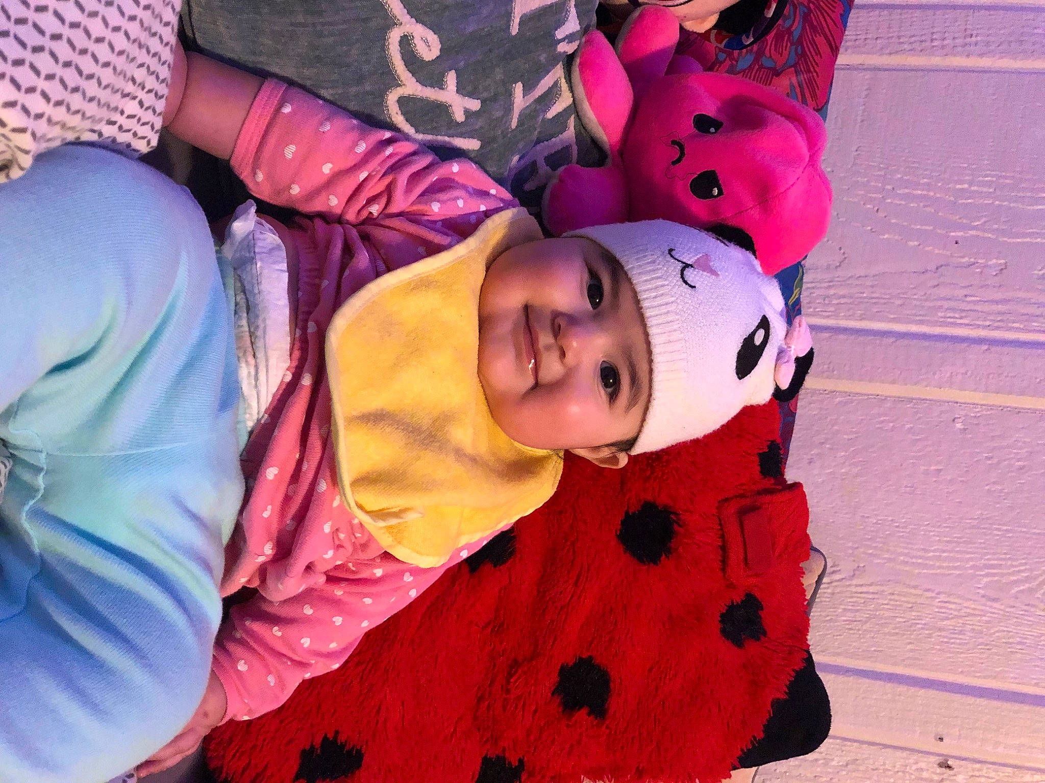 Leeyana is registered to the contest to win money with this photo: baby, carmine, child, costume, event, flooring, fun, happy, headwear, joy, leisure, magenta, orange, pattern, person, pink, plant, purple, smile, textile
