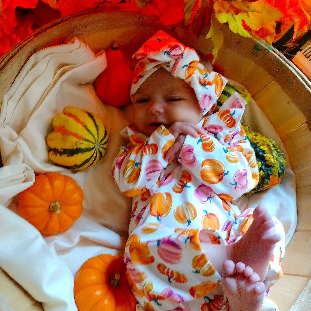 Riverlynn is registered to the contest to win money with this photo: baby, baby_products, baby_sleeping, baby_toddler_clothing, bed_sheet, bedtime, blanket, child, comfort, headwear, linens, nap, orange, pattern, peach, person, room, sleep, toddler