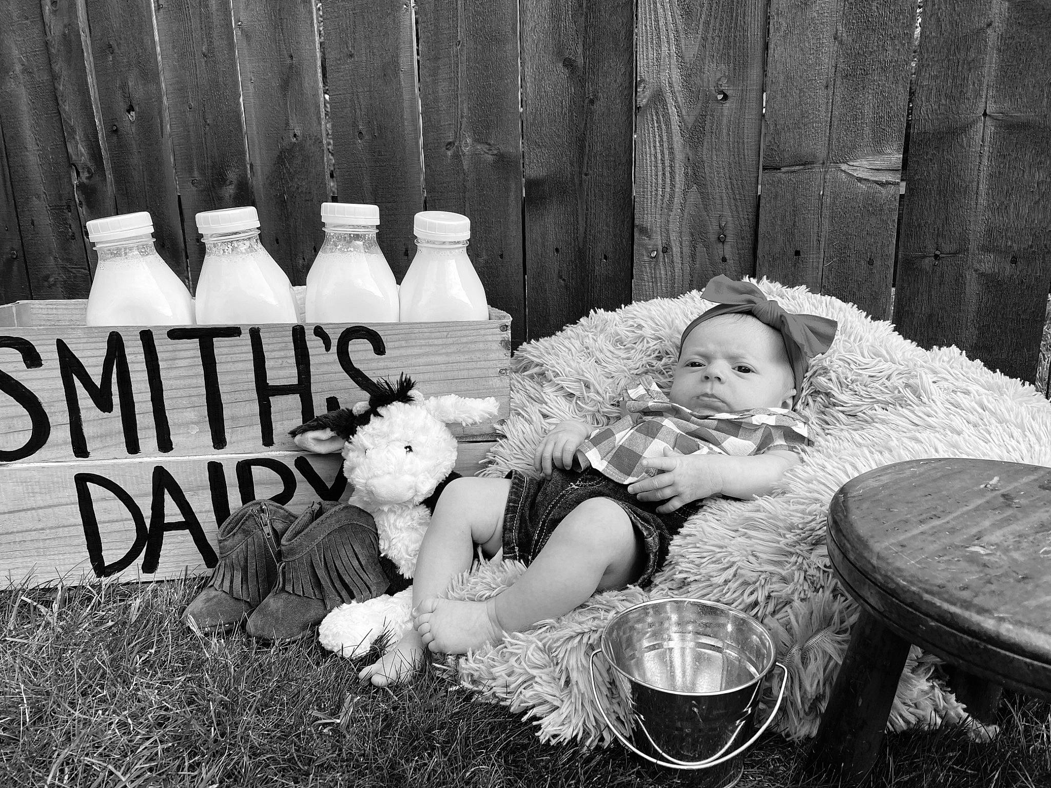 Oaklee is registered to the contest to win money with this photo: baby, black, black_and_white, bottle, grass, hand, happy, hat, human, mammal, monochrome, monochrome_photography, people, person, plant, plastic_bottle, style, toddler, toy, white