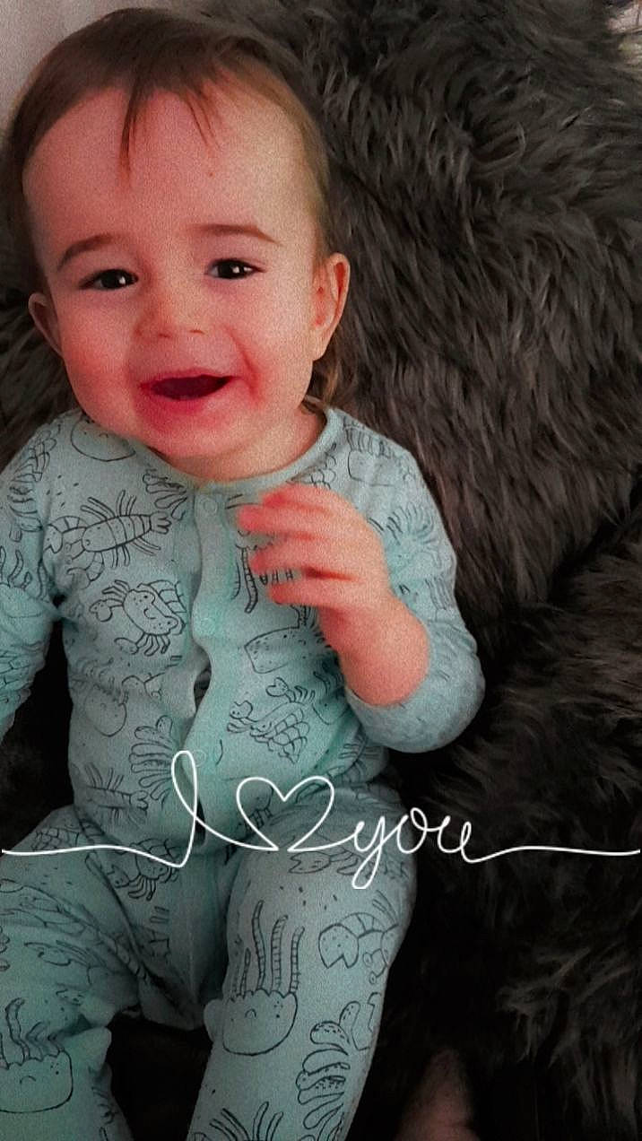 Elliott is registered to the contest to win money with this photo: arm, baby_toddler_clothing, cheek, chin, eye, eyebrow, face, facial_expression, flash_photography, hand, head, human_body, joy, lip, mouth, neck, nose, person, skin, sleeve