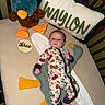 Waylon joined the competition — help win amazing prizes! baby, crib, blanket, plush_toy, pillow, onesie, baby_clothing, soft_toy, stuffed_animal, wooden_sign, face, infant, baby_boy, bedroom, sleeping_area, cute, milestone, colorful, car_prints, baby_bedding
