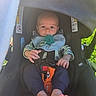 baby, child, infant, car_seat, pacifier,  안전_harness, portrait, sitting, outdoor, vehicle, travel, face, eyes, hands, clothing, bib, blanket, greenery, daylight, safe