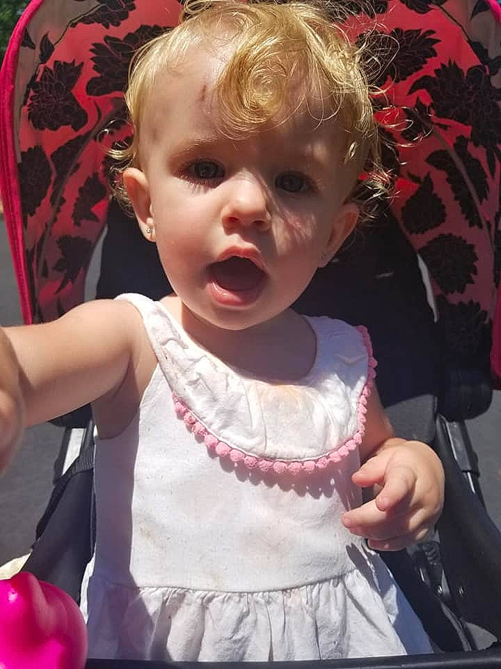 Bailey joined the competition — help win amazing prizes! baby, child, dress, ear, person, pink, smile, toddler