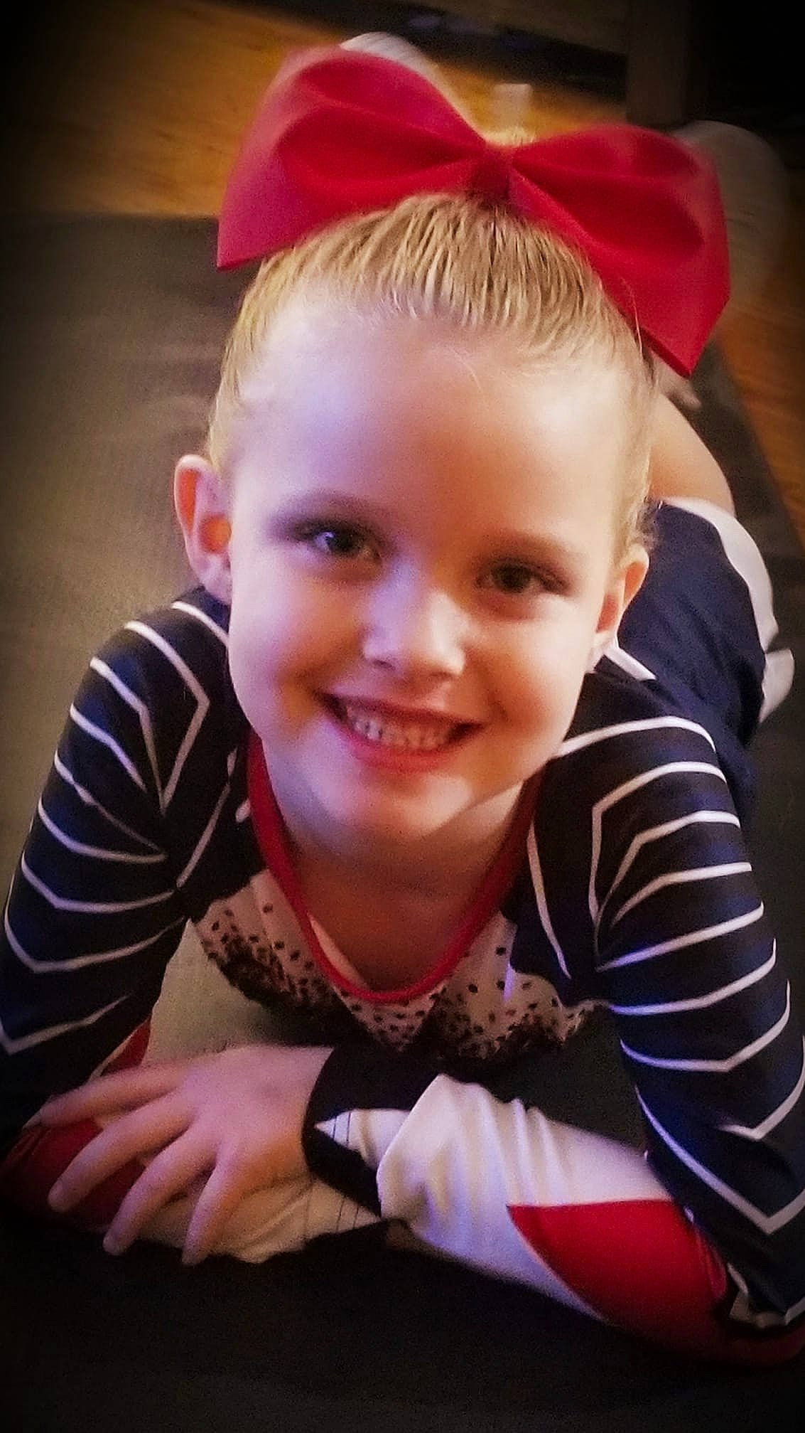 Emrie is registered to the contest to win money with this photo: baby, blond, cheek, child, child_model, ear, face, facial_expression, forehead, hair, hair_accessory, happy, head, headgear, joy, lip, person, photography, portrait, skin