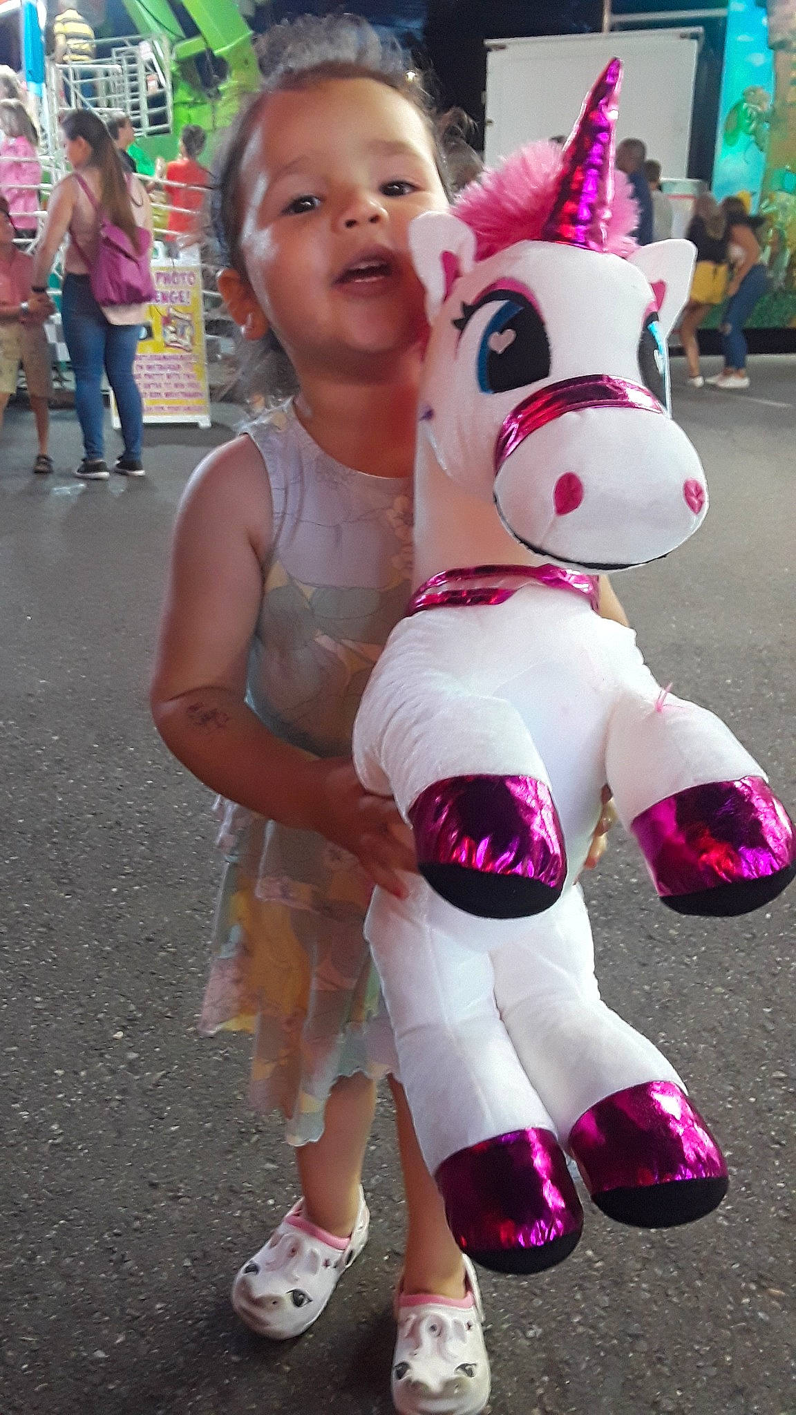 Reagan is registered to the contest to win money with this photo: child, fawn, fictional_character, fun, mascot, person, plush, textile, toy, unicorn