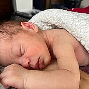 Abel is registered to the contest to win money with this photo: newborn, baby, sleeping, blanket, arm, skin, face, ear, peaceful, rest, infant, closeup, cozy, indoors, human, child, soft, nap, toddler, portrait
