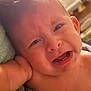 baby, crying, toddler, close_up, face, skin, hand, expression, indoor, towel, emotion, unhappy, person, child, mouth, head, young, skin_tone, teeth, upset