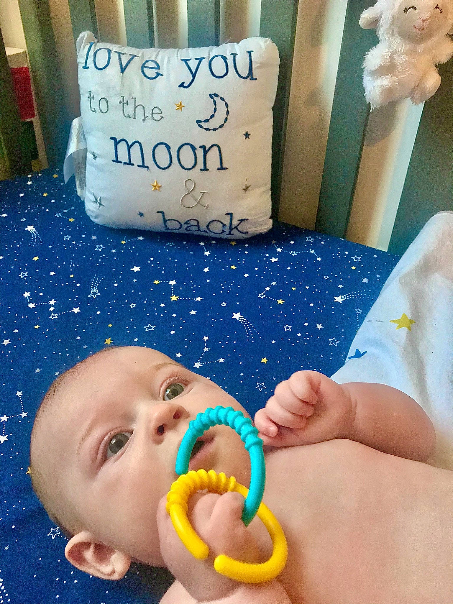 Jacob is registered to the contest to win money with this photo: azure, baby, baby_playing_with_toys, baby_products, baby_sleeping, bedding, blue, child, happy, linens, mouth, nose, person, photograph, pillow, product, room, throw_pillow, toddler, toy