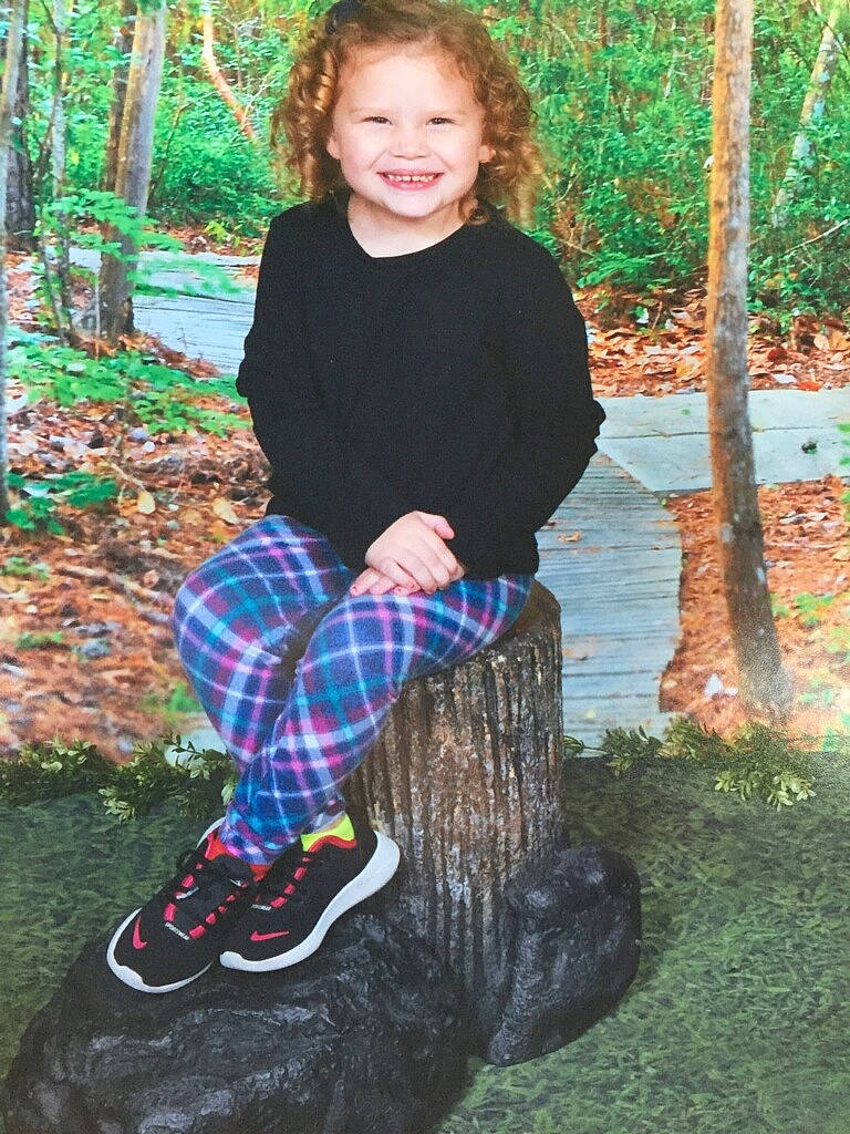 Cheyenne joined the competition — help win amazing prizes! baby_toddler_clothing, fun, grass, green, happy, joy, leaf, outerwear, people_in_nature, person, plaid, plant, recreation, sleeve, smile, sock, standing, tartan, toddler, tree